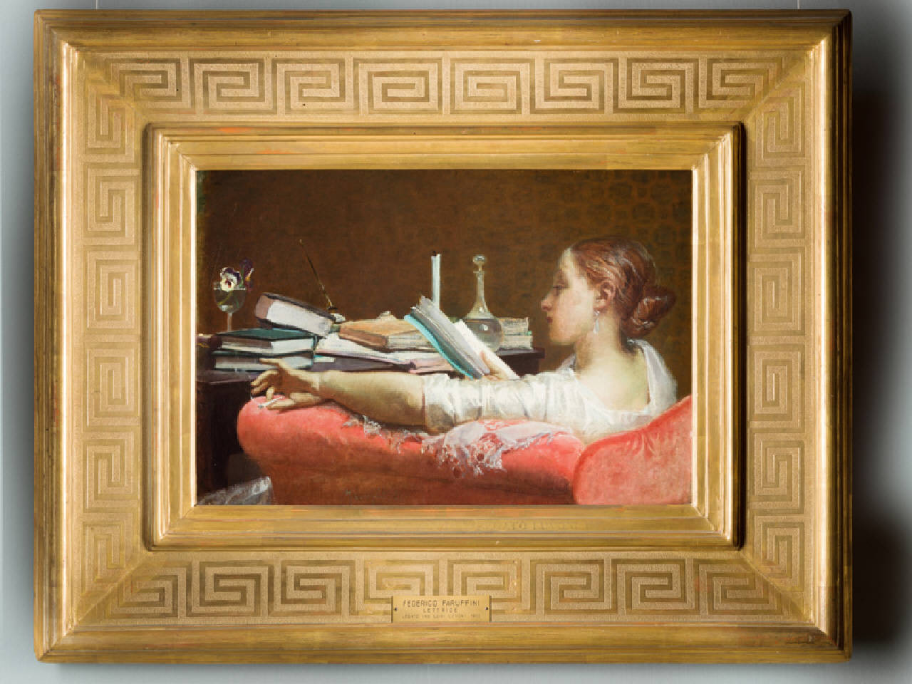 Lettrice, giovane donna, seduta in una poltrona rossa e attorniata da llibri sparsi su un tavolo, legge un libro (dipinto) di Faruffini Federico (terzo quarto sec. XIX)