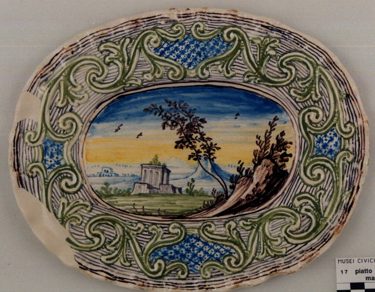 Finte architetture con paesaggio (piatto ovale) - produzione pavese (fine/inizio secc. XVII/ XVIII)