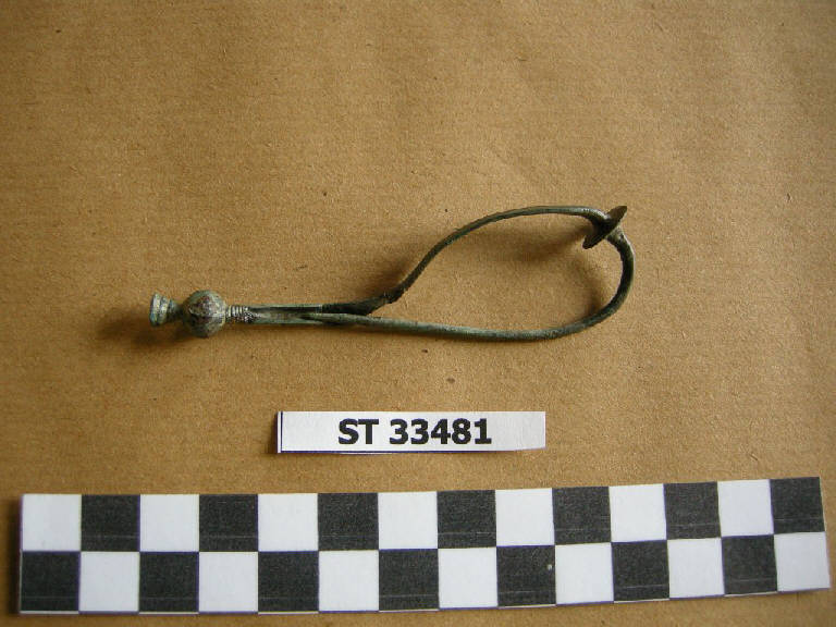 fibula con arco a nastro - cultura di Golasecca (fine/inizio secc. VII/ VI a.C.)