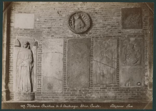 Scultura - Gruppo di lapidi - Milano - Basilica di Sant'Ambrogio - Atrio - Parete