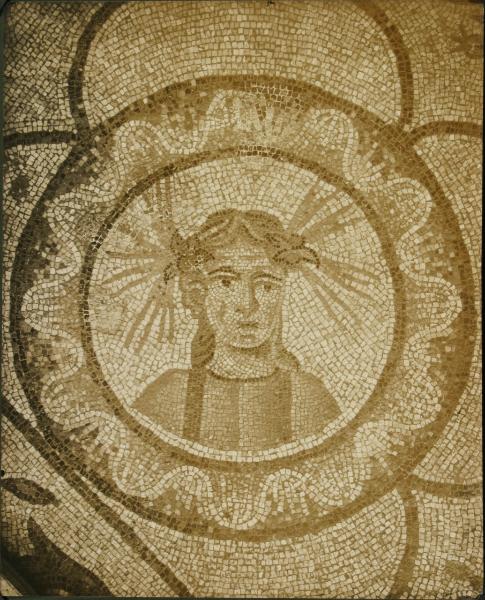 Aquileia - Basilica. Particolare del mosaico pavimentale con il ritratto dell'estate raffigurata con una corona di ciliegie rosse e spighe gialle tra i capelli (IV sec.).