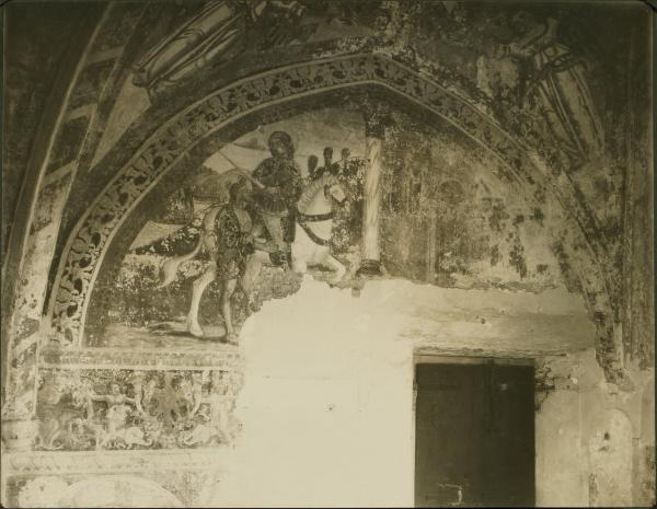 Tapogliano - Chiesa parrocchiale. sacrestia, L'elemosina di S. Martino che divide il suo mantello, affresco (1490 ca.).