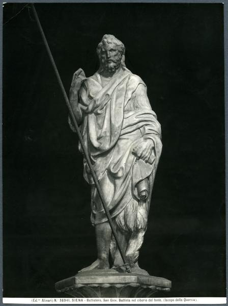 Siena - Battistero. Fonte battesimale, Jacopo della Quercia, S. Giovanni Battista, statuetta in marmo sopra il ciborio.