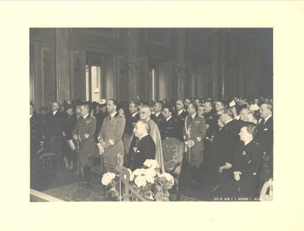 Istituto dei Ciechi di Milano - Sala Barozzi - Interno - Celebrazione centenario della fondazione dell'Istituto - Cerimonia - Platea - Presente il Principe di Piemonte, il Conte di Torino, il Duca di Bergamo, autorità politiche della città