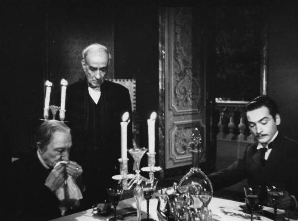 Scena del film "Giacomo l'idealista" - Regia Alberto Lattuada - 1943 - Gli attori Domenico Viglione Borghese, Andrea Checchi tavola e un attore non identificato