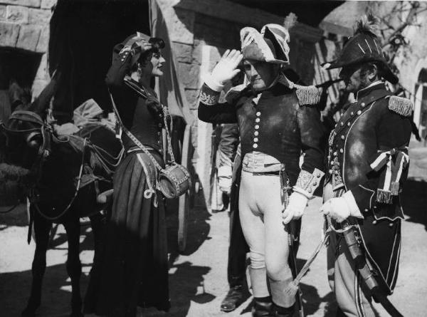 Scena del film "Donne e briganti" - Regia Mario Soldati, 1950 - Jacqueline Pierreux e Jean Chevrier, si scambiano il saluto militare. A destra, un altro attore non identificato.