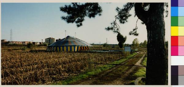 Casarile - campi - tenda da circo - strada sterrata - centro urbano