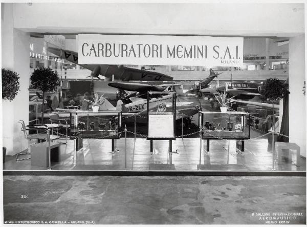 Fiera di Milano - Salone internazionale aeronautico 1937 - Settore accessori, strumenti e materie prime lavorate e semilavorate - Stand di carburatori Memini SAI