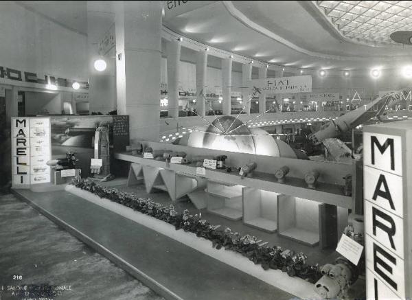 Fiera di Milano - Salone internazionale aeronautico 1937 - Settore accessori, strumenti e materie prime lavorate e semilavorate - Stand di generatori e convertitori per radio della Ercole Marelli