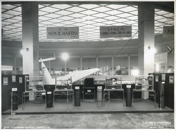 Fiera di Milano - Salone internazionale aeronautico 1937 - Settore accessori, strumenti e materie prime lavorate e semilavorate - Stand della S.A. Monti & Martini e della "Itala"