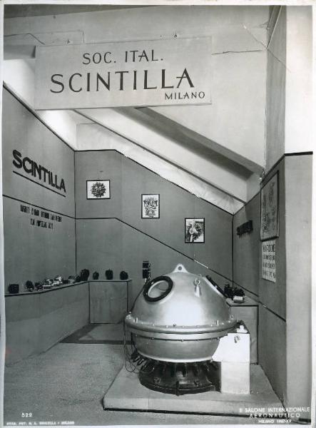 Fiera di Milano - Salone internazionale aeronautico 1937 - Settore accessori, strumenti e materie prime lavorate e semilavorate - Stand della Società italiana "Scintilla"