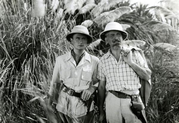 Scena del film "Giungla" - Malasomma, Nunzio, 1942 - In mezzo alla giungla: mezze figure di Rodolfo Fernau, a sinistra, e Albrecht Schönhals, a destra.
