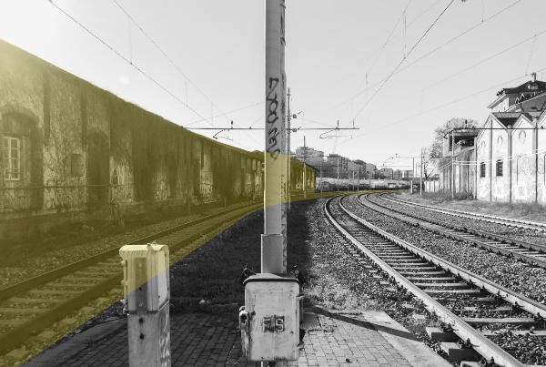 Milano - Scali ferroviari - Scalo Porta Genova - Pali elettrici - Edifici di servizio - Vegetazione - Binari ferroviari - Muro di cinta - Palazzi, sullo sfondo