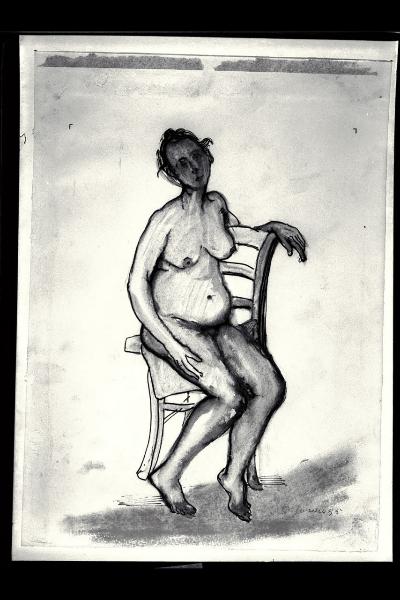 Donna nuda seduta