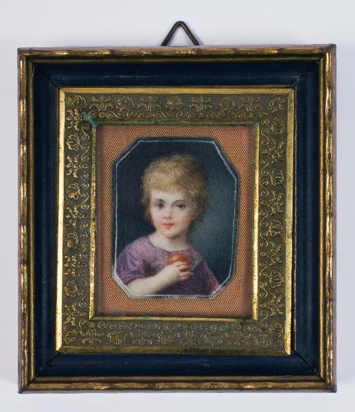 Ritratto di bambino con la mela in mano