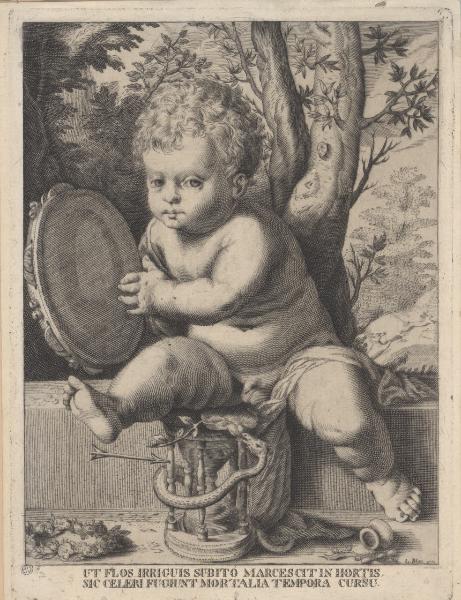Un bambino che gioca con un tamburello