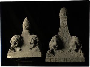 Aquileia - Museo Archeologico. Lapidario, due terminazioni piramidali di urne con leoni custodi.